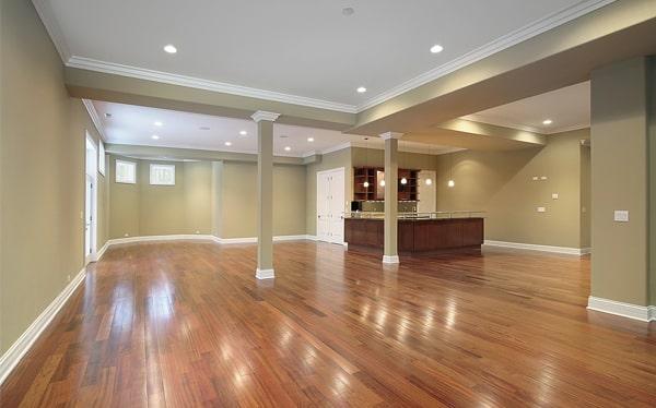 hardwood flooring can be installed in a basement or a room with a concrete subfloor with proper preparation